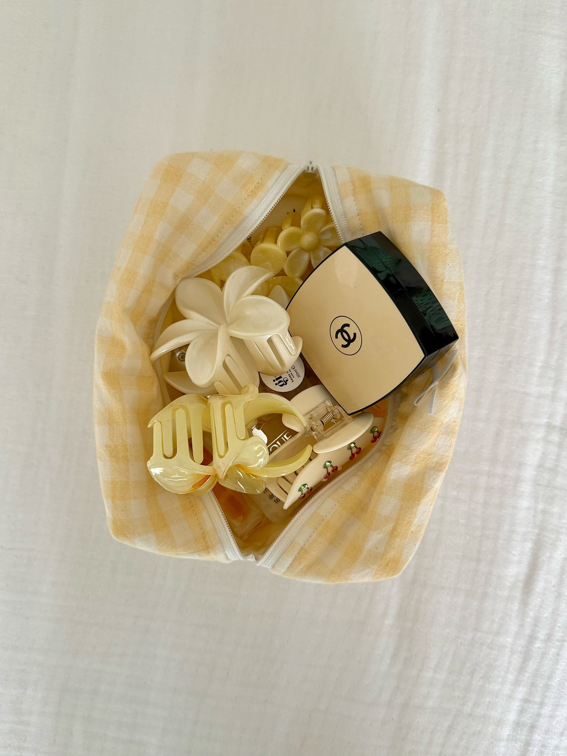 Yellow Gingham Cotton Makeup Pouch holding makeup essentials, Colorcarry