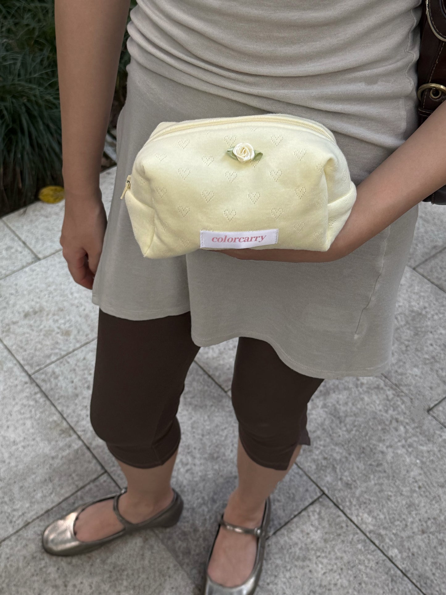 Butter Angle yellow Knit Heart Makeup Pouch in everyday use, holding makeup and small essentials, Colorcarry